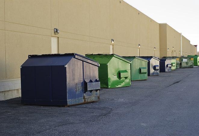 dumpsters lined up for use on busy construction site in Harrisville